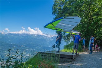 A closup of a person flying on a hang glider