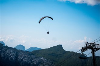 Paragliding flight in the mountains. Le Grand-Bornand, France