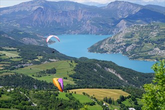 paragliding above serre ponçon lake alps france