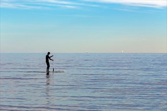 Practice of Stand Up Paddle in the Mediterranean. Carnon, Occitanie, France