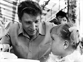 BURT LANCASTER candid with his daughter publicity for VERA CRUZ 1954 director ROBERT ALDRICH Hecht-Lancaster Productions / Flora Productions / United Artists