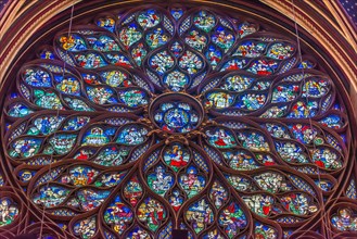 Paris, France - Dec. 27 2022: The stunning stained glass window and the beautiful ceiling in Saint-Chapelle in Paris