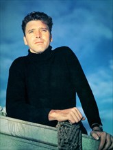 1953 c. : The movie actor BURT LANCASTER ( 1913 - 1994 ) , pubblicity still - MOVIE - CINEMA - portrait - ritratto  - sex symbol - beefcake - hunk - maglione nero - magllia nera - golf - black dress -...