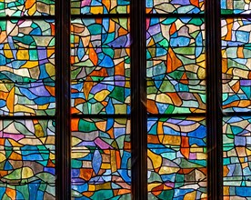 ABBEVILLE, SOMME, FRANCE, JUNE 20, 2023 :  details of stained glasses windows in Saint Sepulcre church, by Alfred Manessier workshop, year 1989  to 19