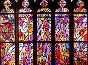 ABBEVILLE, SOMME, FRANCE, JUNE 20, 2023 :  details of stained glasses windows in Saint Sepulcre church, by Alfred Manessier workshop, year 1989  to 19