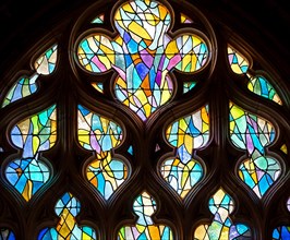 ABBEVILLE, SOMME, FRANCE, JUNE 20, 2023 :  details of stained glasses windows in Saint Sepulcre church, by Alfred Manessier workshop, year 1989  to 19