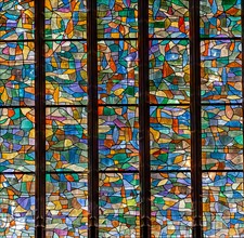 ABBEVILLE, SOMME, FRANCE, JUNE 20, 2023 :  details of stained glasses windows in Saint Sepulcre church, by Alfred Manessier workshop, year 1989  to 19