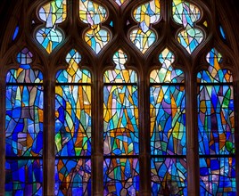 ABBEVILLE, SOMME, FRANCE, JUNE 20, 2023 :  details of stained glasses windows in Saint Sepulcre church, by Alfred Manessier workshop, year 1989  to 19