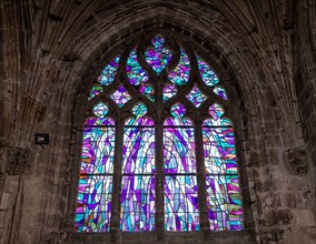 ABBEVILLE, SOMME, FRANCE, JUNE 18, 2023 :  details of stained glasses windows in Saint Sepulcre church, by Alfred Manessier workshop, year 1989  to 19