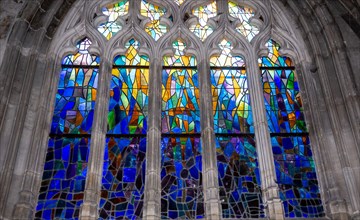 ABBEVILLE, SOMME, FRANCE, JUNE 18, 2023 :  details of stained glasses windows in Saint Sepulcre church, by Alfred Manessier workshop, year 1989  to 19