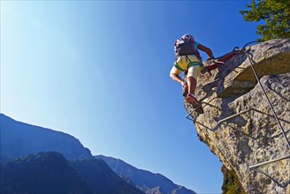 climber on a steep rock face, Via Ferrata, France, Savoie, Maurienne, Saint-Colomban-les-Villards