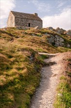 Stone cottage at Pointe de Tal Ar Grip along hiking trail GR34, Pors-Ar-Vag, Douarnenez bay, Plomodiern, Finistere (29), Brittany, France