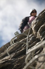 A close-up of the handles embedded in the rock for the sport of Via Ferrata.