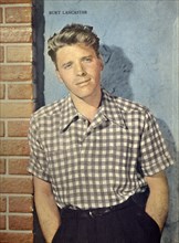 A vintage Hollywood publicity still of Burt Lancaster in the early 1950s from a film fan magazine.