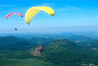 Hang gliding near the Puy de Dome volcano in Auvergne, France.