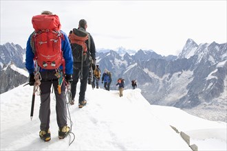 Italy - France, Mont Blanc, Aiguille du Midi, climbers setting out from the summit