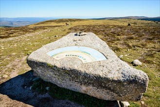 View indicator on granite boulder at the summit Pic de Finiels on Mont Lozère in the Cévennes, Lozère, France