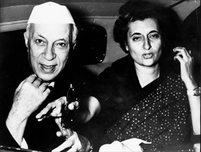 Indira Gandhi and father Jawaharlal Nehru riding in a car