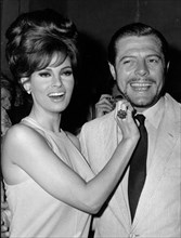 Actors Marcello Mastroianni and Raquel Welch at party