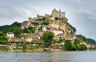 The france city of Beynac-et-Cazenac as seen from the river Dordogne
