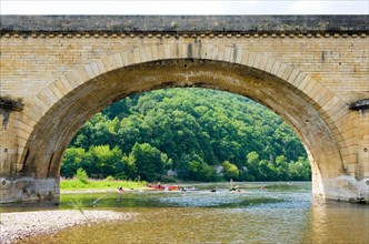 Arch of the bridge of Grolejac over the river Dordogne in France