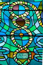 Colorful stained glass windows done by Jean Cocteau in a chapel in Metz, France