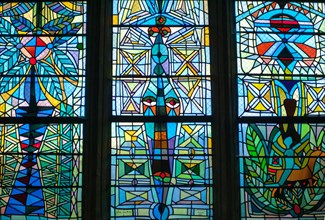 Colorful stained glass windows done by Jean Cocteau in a chapel in Metz, France