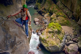 man climbing at via ferrata, France, Mercantour National Park, Lantosque