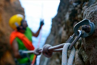 carabiner and climbing rope for canyoning in the canyon called Souffleur on the cliff of La Ciotat, France, Provence, Calanques National Park, La Ciotat