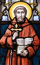 STABROEK, BELGIUM - JUNE 27, 2015: Stained glass window depicting Saint Francis of Assisi in the Church of Stabroek, Belgium.