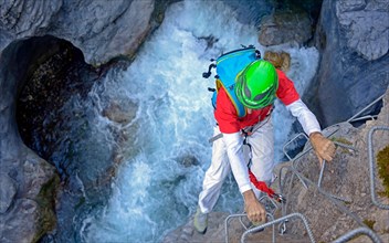 climber at Via ferrata of Chateau Queyras, France, Hautes Alpes