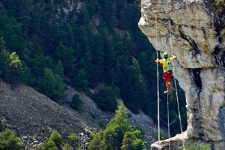 climber on a wire rope, via ferrata called Les Rois Mages, France, Savoie, Vanoise National Park, Aussois