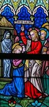 LIER, BELGIUM - MAY 16, 2015: Stained Glass window (1886) in St Gummarus Church in Lier, Belgium, depicting the Raising of Lazar