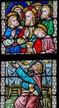 LIER, BELGIUM - MAY 16, 2015: Stained Glass window in St Gummarus Church in Lier, Belgium, depicting Jesus and the Apostles at t