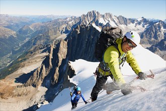 Mid adult couple mountaineering, Chamonix, Haute Savoie, France