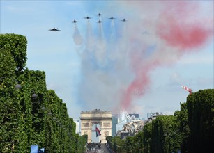 U.S. F-35 Fighter aircraft and the USAF Thunderbirds perform a flyby over the Arc de Triomphe during the annual Bastille Day military parade July 14, 2017 in Paris, France. U.S. President Donald Trump...