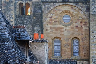 CONQUES, FRANCE, June 19, 2015 : The St.Foy abbey in Conques is a popular stop for pilgrims on their way to Santiago de Compostela. The main draw for