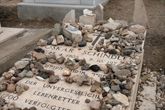 Inscription on Oskar Schindler grave in Hebrew and German reads“Oskar Schindler A righteous man among the Gentiles. The unforgettable life savor of 1200 persecuted Jews” located in the Roman Catholic...