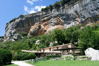 Buoux, France - June 26 2007: cyclists eat in restaurant of Auberge under the cliffs of the buoux fort, France. Auberges are rural Inns typically with