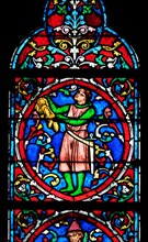 Colorful stained glass window in the Notre Dame Cathedral, UNESCO World Heritage Site in Paris, France