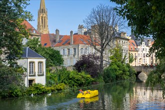 Paddle boat / pedal boat with tourists on the Moselle river in the city Metz, Moselle, Lorraine, France