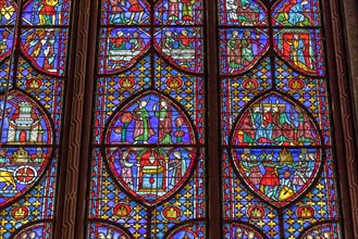 Detail of a stained glass window in Sainte-Chapelle , a royal chapel in the Gothic style, within the medieval Palais de la Cité , Paris