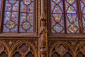 Detail of a stained glass window in Sainte-Chapelle , a royal chapel in the Gothic style, within the medieval Palais de la Cité , Paris