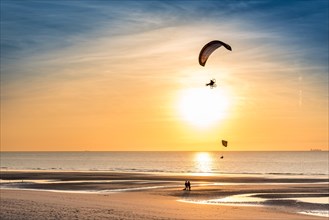 Paramotors in the sky of Wissant (France), at sunset.