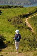 PLOUHA, FRANCE -May25 2017 : Hiker on the GR34 at Plouha