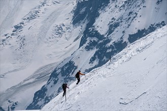 Mountaineers returning to Aiguille du Midi on sunny summer day in Chamonix, France