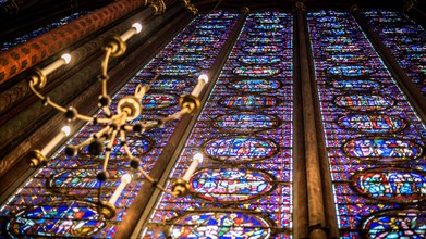 Paris, France-14 January, 2018: View interior of the famous Saint Chapelle, details of beautiful glass mosaic windows. Holy Chapel is a one of the mos