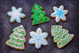 christmas food, handmade cookies gingerbread like christmas tree and snowflakes with flour like snow