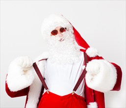 Cool Santa in red glasses holding his suspenders on white