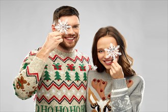 happy couple at christmas ugly sweater party